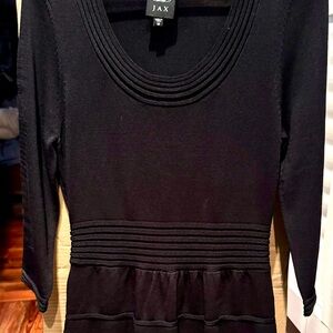 Black sweater dress, below the knee.